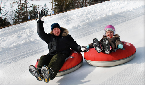 Take in some extreme or unique winter sports and activities like Snow Tubing!