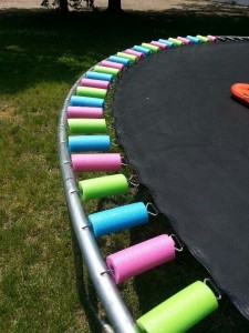 Wrap trampoline springs with pool noodles Fun & Festive!