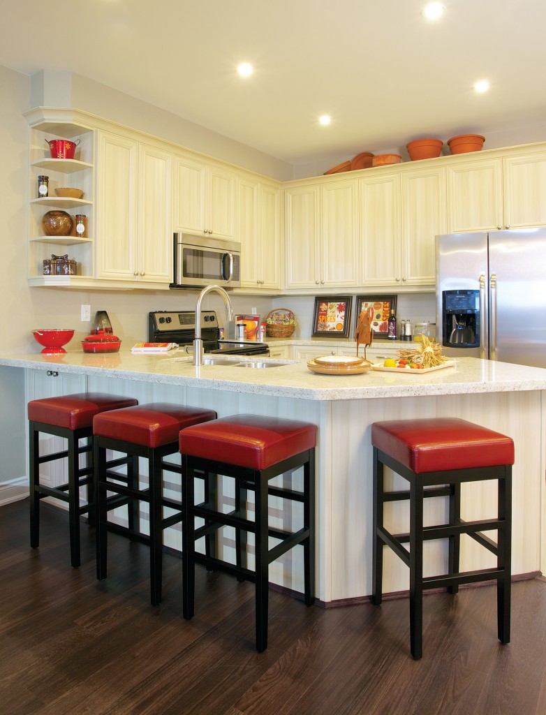 The red chairs bring a sharp look to this Geranium model home.