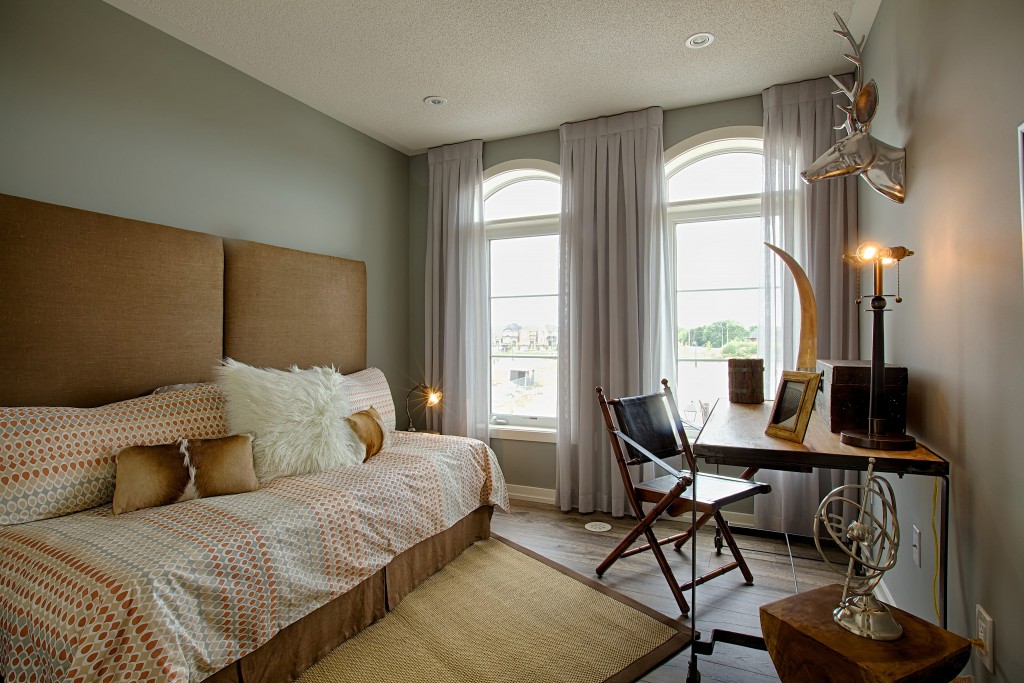 Jo-Ann created an organic, textured look with natural materials and various shaped elements in our Uptownes model home