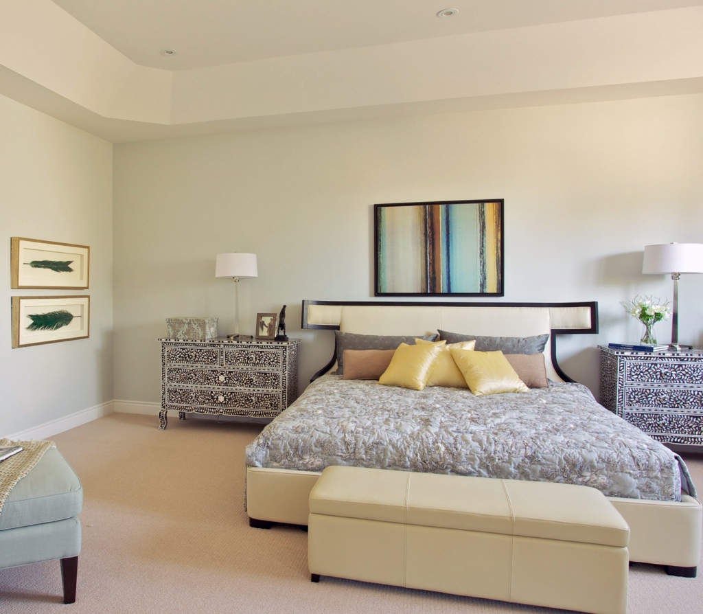 The upholstered headboard adds a soft, classic vibe to the master bedroom in Forest Trails.