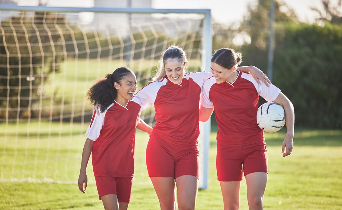 Teens playing soccer